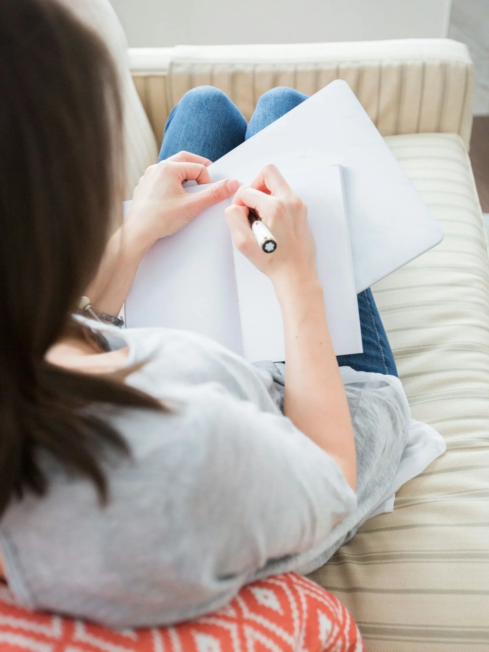 Woman taking notes on fertility journey, making choices and creating a new vision for family planning